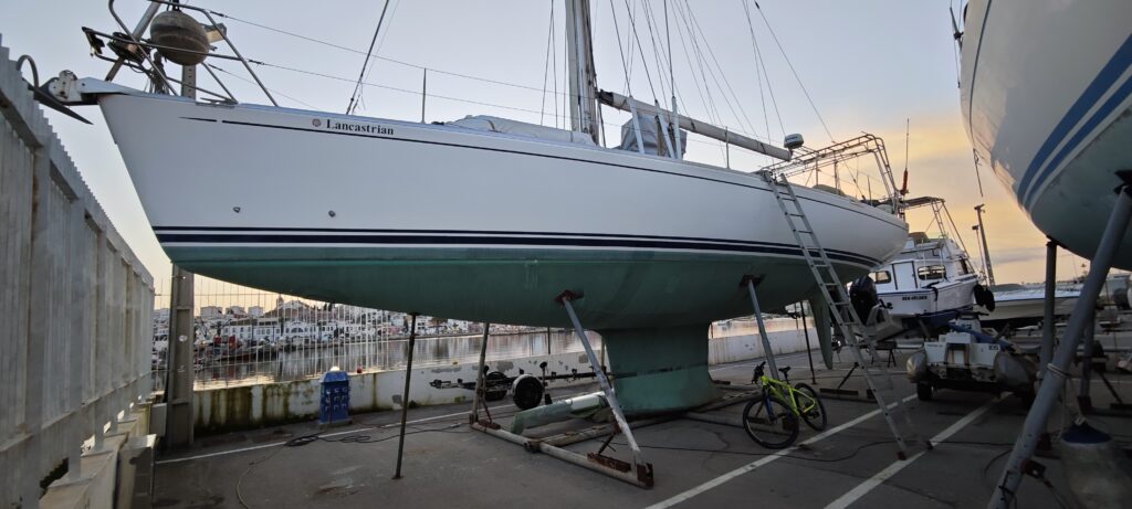Full side profile of Lancastrian ashore in the Lagos boatyard